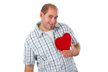 Image showing Young man holding red heart