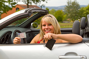 Image showing Young woman happy about her new drivers license