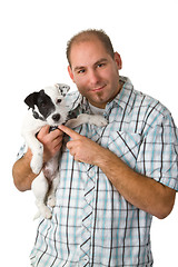 Image showing Young man and his puppy