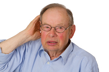 Image showing Male senior with hand on ear