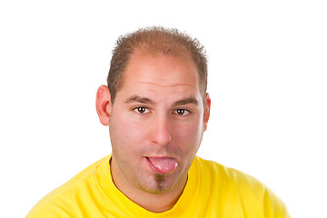 Image showing Young man with put out a tongue