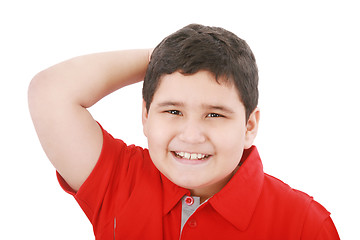 Image showing Young boy looking up with hand between the hair 