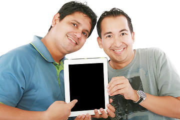 Image showing Two young men or businessmen showing a tablet PC computer and sm