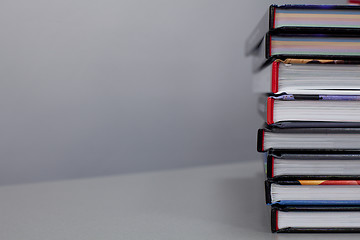 Image showing stack of books on the table