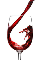 Image showing Red wine pouring into wine glass