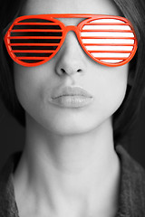 Image showing red sunglasses on the face