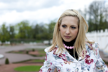 Image showing blonde girl on the background of the park