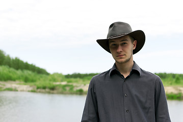 Image showing man in a cowboy hat standing 