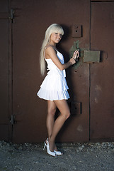 Image showing girl opens old garage