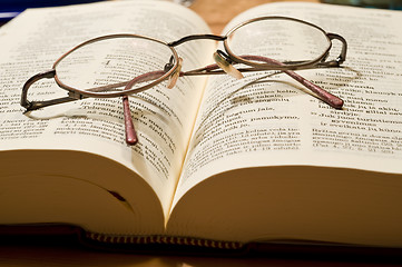 Image showing Glasses and book