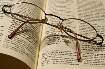 Image showing Glasses and book