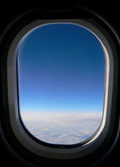 Image showing View from aeroplane window onto cloud & blue sky.