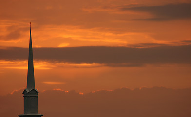 Image showing Church steeple set against sunset