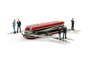 Image showing business people on penknife