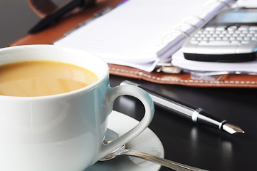 Image showing cup of coffee in the office