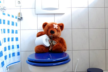 Image showing toy teddy bear on wc toilet