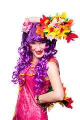 Image showing female clown with colorful flowers