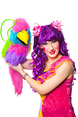 Image showing female clown with colorful toy bird