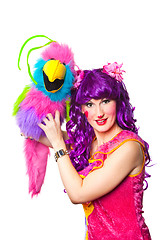 Image showing female clown with colorful toy bird