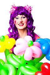 Image showing female clown with colorful balloon flowers