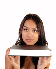 Image showing Woman holding a book.