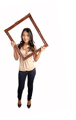 Image showing Girl holding picture frame.