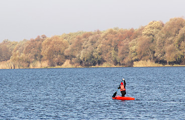 Image showing Sportsman in a red canoe