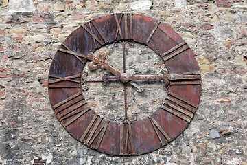 Image showing Rusty old clock on the wall