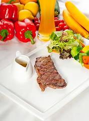 Image showing juicy BBQ grilled rib eye ,ribeye steak and vegetables