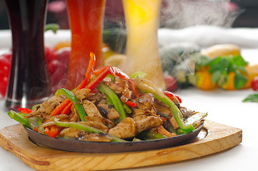 Image showing original fajita sizzling hot  on iron plate