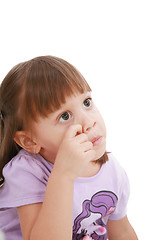 Image showing Baby's scratching her nose. Little child scratching her nose.