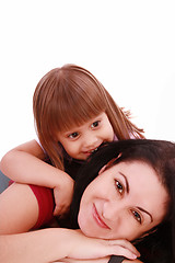 Image showing A portrait of a mother and her baby girl lying on the floor and 
