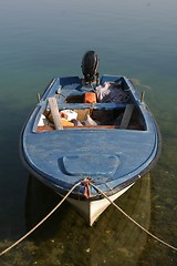 Image showing A wooden rowing boat tide down