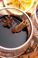Image showing Mulled wine with slice of orange and spices.