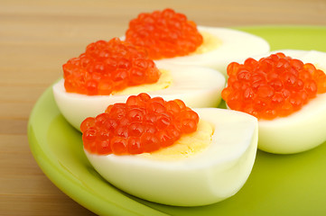 Image showing red caviar on chicken egg