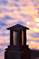 Image showing Stone lamp at seashore