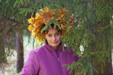 Image showing Girl In Wreath Of oranga and yellow Leaves