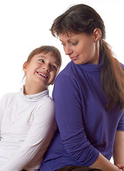 Image showing smiling mother and daughter look at each other