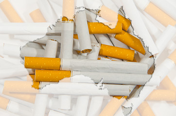 Image showing Map of Australia with cigarettes in background