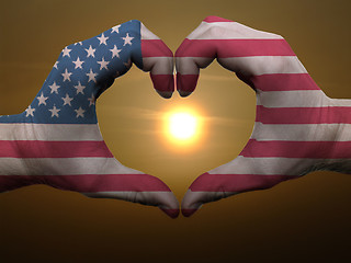 Image showing Heart and love gesture by hands colored in american flag during 