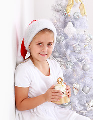 Image showing Girl holding Christmas bell