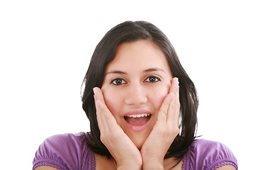 Image showing Portrait of young surprised girl holding her face 