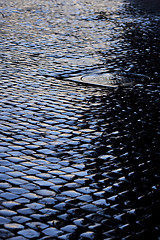 Image showing Cobbled street after rain