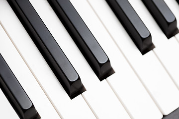 Image showing Close up shot of black & white piano keys 