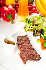 Image showing juicy BBQ grilled rib eye ,ribeye steak and vegetables