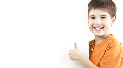 Image showing Smiling boy showing thumb