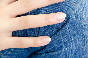 Image showing Women's knee in jeans closeup