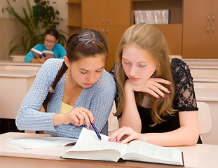 Image showing Students reading a book