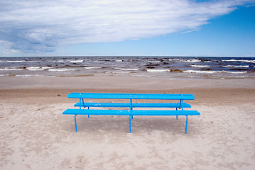 Image showing Blue bench on the beach 