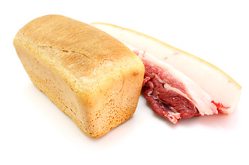 Image showing Roll of fresh bread and the big piece of fat with meat 